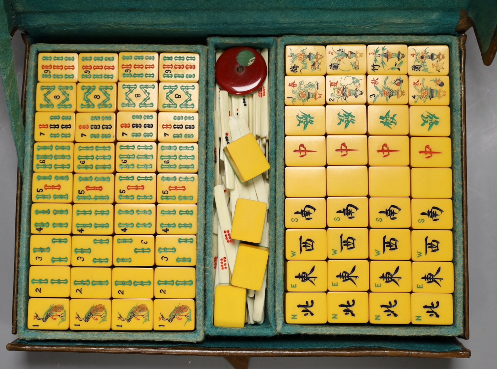 A 1920's leather travelling mahjong set